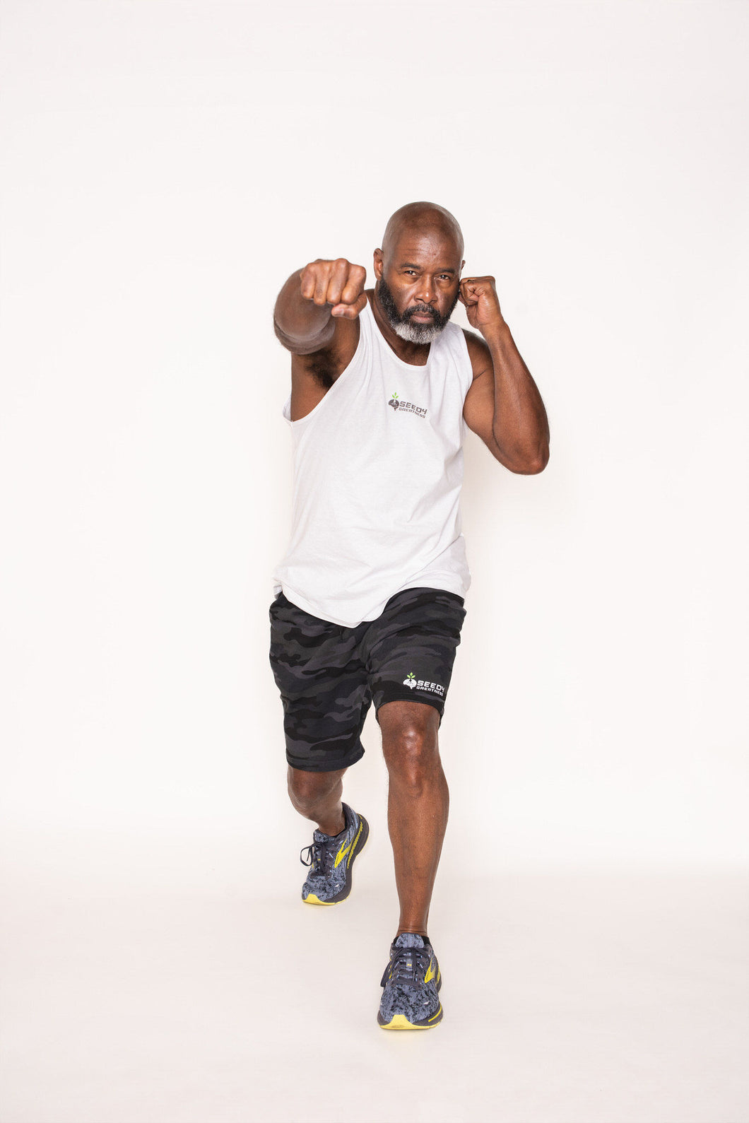 Cotton White tank top and black camouflage shorts